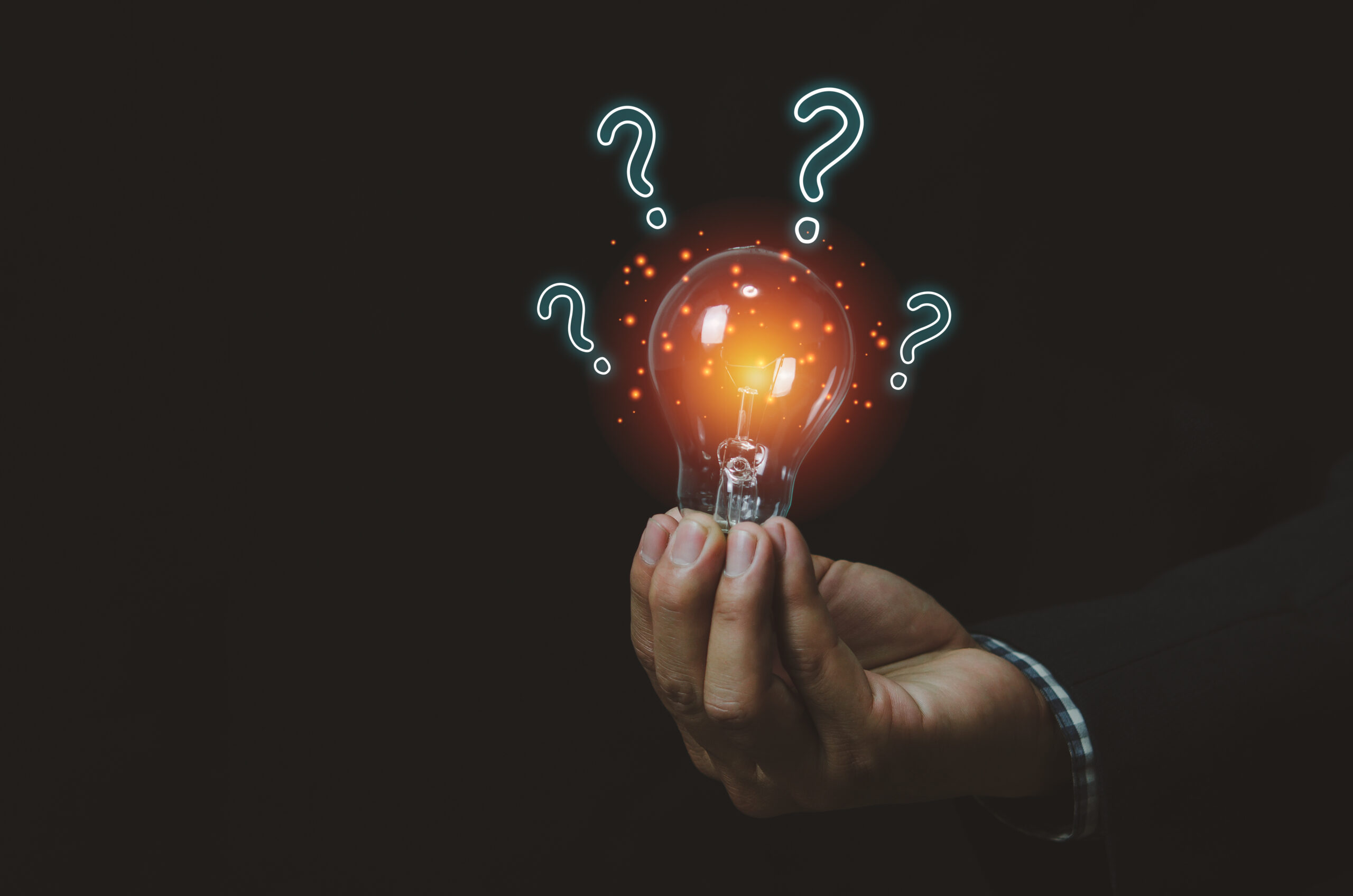 businessman holding a light bulb with question mark.Digital creative design concept technology marketing.